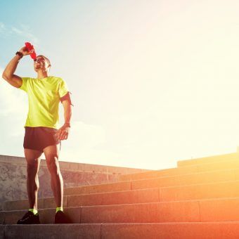 bigstock-Dark-skinned-runner-drink-wate-73625380