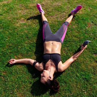 exhausted runner after fitness running workout catching breath
