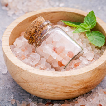 Closeup Himalayan Pink Salt In Wooden Bowl And Bottle  With Pepp