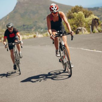 Cyclist Riding Bikes On Open Road