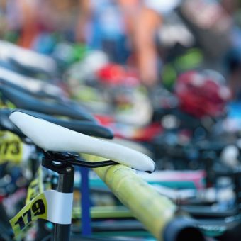 Triathlon the transition zone.Bicycles at triathlon change over station.