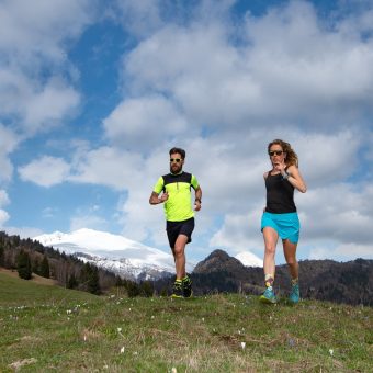 Couple Of Male And Female Athletes Train In The Mountains