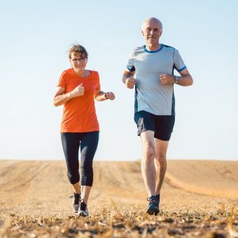 bigstock-Senior-woman-and-man-running-o-265014751