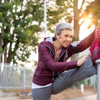 bigstock-Senior-woman-using-lamp-post-a-269124568